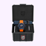 Close-up of the Luminox XS.3253.CBNSF.SET uni-directional rotating bezel with orange numerals and maritime safety color accents
