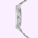 Side view of the Mido Watches Baroncelli Signature Gent M0374071104100 in silver, showcasing its metallic link band and round crown, equipped with the renowned MIDO Caliber 80 Swiss automatic movement, displayed against a light lavender background.