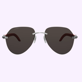 Front view of Cartier Sunglasses CT0007CS 057 Men METAL WOOD, showcasing dark oval lenses, a sleek silver metal frame with nose pads, and distinctive reddish-brown wood temple arms for a refined look—an ideal choice in men’s eyewear from Cartier Sunglasses—presented against a light background.