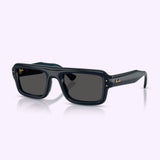 Ray-Ban Sunglasses 0RB4954 68958752 in transparent dark blue feature thick frames, dark UV-protective lenses, and small gold logos on the arms and front corners, displayed against a light purple background.