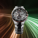 The Seiko Luxe Watches King Watches Astron SSH183 Limited Edition is featured with its striking silver and black band, set against a dynamic backdrop of swirling orange, brown, and green light trails.