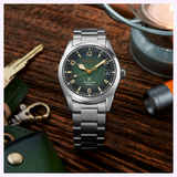 Close-up of Seiko SPB155 Baby Alpinist gradated green dial with gold indices and LumiBrite cathedral hands