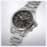 Close-up of Seiko SPB505 Alpinist black dial with inner rotating compass bezel and white LumiBrite hands