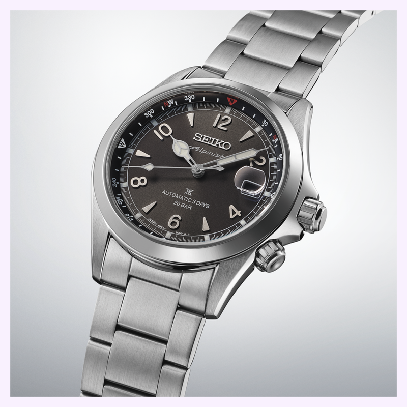 Close-up of Seiko SPB505 Alpinist black dial with inner rotating compass bezel and white LumiBrite hands