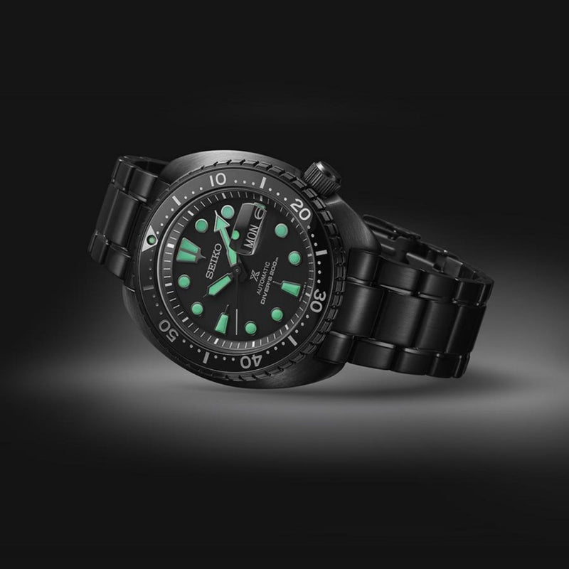 Seiko SRPK43 Black Series ceramic bezel and green Lumibrite Pro dial detail