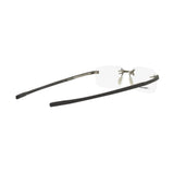 Tag Heuer Optical TH50004U 56091 rimless eyeglass frame with black temples and clear lenses, shown from a rear side angle on a white background.