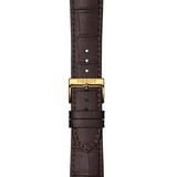 Brown leather strap for a Tissot T1294103626100 CLASSIC DREAM Men Watch, featuring a gold-tone buckle engraved with the Tissot logo.