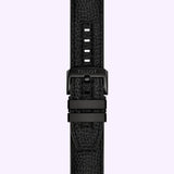 A black Tissot Watches strap with textured material, black buckle, and matching loops is shown vertically on a light purple background—crafted for the TISSOT Watches Supersport NBA Special Edition T1256173706700.