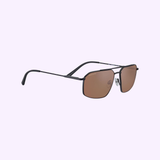 A pair of Bolle Serengeti WAYNE Matte Black - Mineral Polarized Drivers sunglasses with rectangular lenses and slim arms is displayed on a light lavender background.