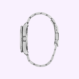 A Citizen Watches AW1840-50X Brycen, crafted from Super Titanium with a slim case and sleek metal link band, is displayed side-on against a light purple background.