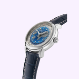 The Frederique Constant Manufacture Classic Worldtimer FC-719BLW3H6 is a luxury Swiss watch with a blue textured dial, silver markers, world time display, polished silver case, and a dark blue leather strap with white stitching.