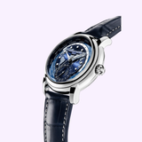The Frederique Constant Manufacture Classic Worldtimer FC-718NWM4H6 is a luxury Swiss automatic watch with a blue world map dial, silver case, navy leather strap, multiple subdials, and city names for world time zones on a light purple background.