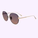 CHOPARD SUNGLASSES SCHL03M ROSE GOLD/BLUE (UPC: 190605500866) shown at an angle with gradient lenses. LEXOR MIAMI logo at the top, Chopard script at the bottom on a light blue background.