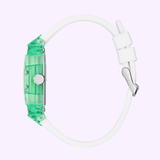 Guess Watches Mens White Green Multi-function GW0499G10 wristwatch by Guess Watches, featuring a translucent green case, skeleton dial, and white silicone strap, shown in side view against a light purple background.