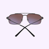 A pair of Bolle Serengeti WAYNE Matte Black - Mineral Polarized Drivers Sunglasses, displayed front-facing with crossed arms and gradient brown lenses against a pale background.
