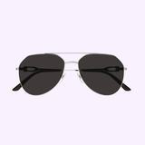 The Cartier CT0364S-001 59 Unisex Sunglasses feature luxury aviator-style silver metal frames and dark tinted lenses by Cartier Sunglasses, shown against a light lavender background.