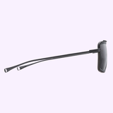 The Dita Sunglasses DLS422-A-04 LSA-422 by Dita Sunglasses are featured in black with thin arms, a rectangular frame, and high contrast design, shown from the side on a light purple background.