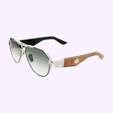 A pair of Maybach SUNGLASSES THE KING III PA/B-WEB-Z66 by Maybach Sunglasses, featuring silver metal frames, gradient dark lenses, and wooden arms with a metallic emblem, displayed on a light purple background.