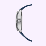 Side view of a Mido Watches SPECIAL EDITION OCEAN STAR DECOMPRESSION WORLDTIMER M026.829.17.041.00 for men, with silver case, blue strap, visible crown and detailed case edge; includes 1 extra strap, set against a light background.