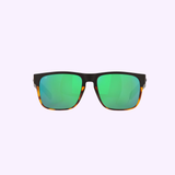 Costa Del Mar Sunglasses 900818 Spearo Matte Black feature green reflective polarized glass lenses set in sleek black frames, with distinctive tortoiseshell accents along the lower edges. Showcased against a light purple background, these Costa Del Mar Sunglasses combine standout style with superior glare reduction.