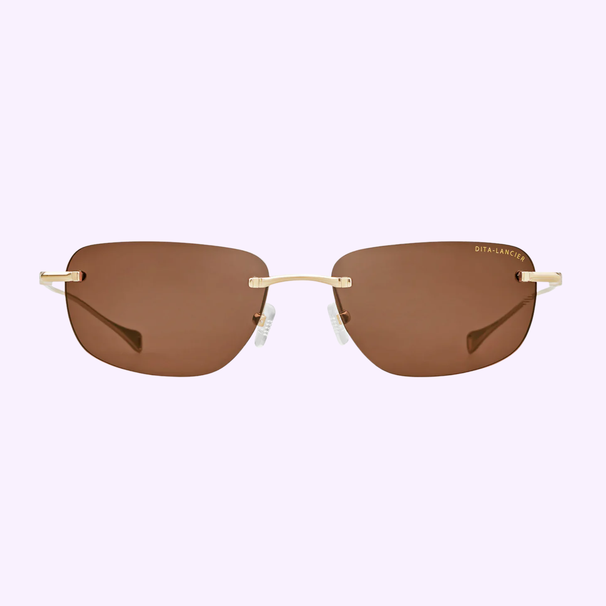 Dita Sunglasses LSA-120 DLS120-A-01 feature a brown rectangular rimless design with gold temples and bridge, clear nose pads, and a subtle gold logo on the right lens. These titanium sunglasses by Dita Sunglasses offer luxury style and comfort.