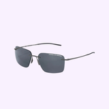 The Porsche Design P8923-C-6218-145-E59 Men Sunglasses feature a square shape, thin black metal arms, dark lenses with the logo on the top right lens, and are shown against a light purple background. Brand: Porsche Design Sunglasses.