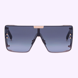 Front view of Balmain Sunglasses BPS-102N-146 Unisex with oversized black rectangular frames, dark blue gradient lenses, and a gold Balmain logo on the bridge. These designer sunglasses feature a bold, modern look against a light background.