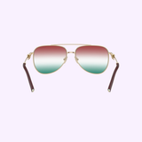 Tiffany & Co. Sunglasses 0TF3116 6230EL59 for women feature gold aviator frames with red, white, and green gradient lenses, displayed against a light purple background. The brown temples accented by gold hinge detailing make these authentic Tiffany & Co. sunglasses a standout choice in women's eyewear.