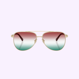 Elevate your eyewear collection with the Tiffany & Co. Sunglasses 0TF3116 6230EL59 for women—authentic gold aviator frames featuring striking gradient lenses that transition from red at the top to teal at the bottom, elegantly showcased on a light purple background for sophisticated modern style.