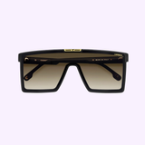 The Carrera Sunglasses VICTORY C 07/S 7C5 feature oversized rectangular black frames, gradient brown lenses, and gold accents, set against a light purple background. Available from your Miami authorized dealer.