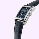 The Frederique Constant Classic Carre Automatic FC-303N4C26 features a rectangular case, blue textured dial, silver hour markers, moon phase display, and dark blue leather strap—a timeless minimalist watch for refined tastes.