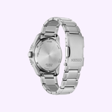 A Citizen Watches AW1840-50X Brycen, seen from the back, displays its stainless steel case back, crown, and a segment of the metal bracelet with a fold-over clasp against a light purple background. Featuring innovative Eco-Drive technology, this Citizen timepiece blends sustainability with timeless style in its classic design.