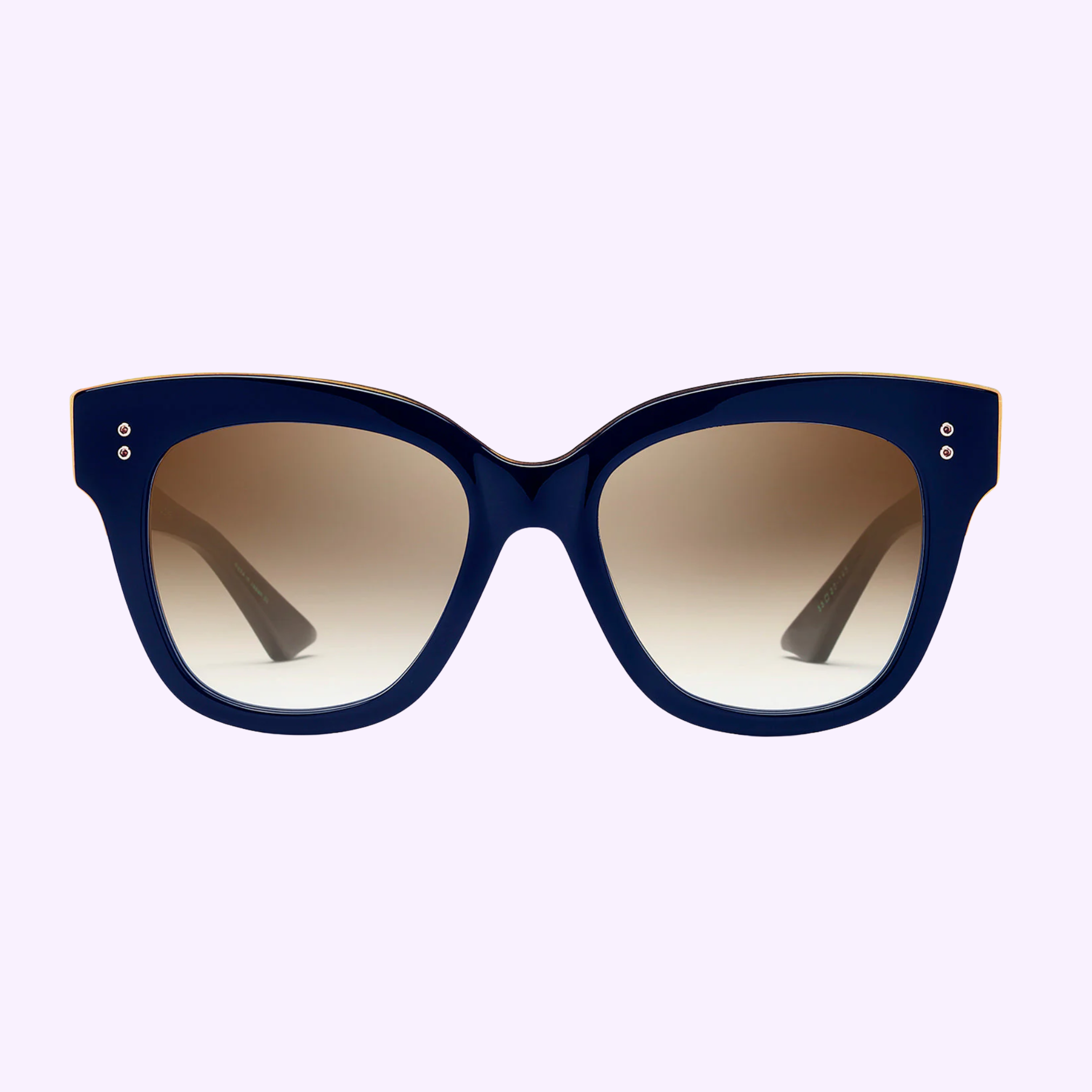 The Dita Sunglasses DAY TRIPPER 22031-D-NVY-GLD-55-Z feature oversized, thick dark blue frames and large lenses fading from dark to light brown—showcasing Japanese craftsmanship—set against a pale lavender background.