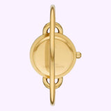 A Tory Burch Watches THE MILLER TBW6019SET women’s watch is photographed from the side, highlighting its round case, understated crown, and metal bracelet—all set against a light purple background.