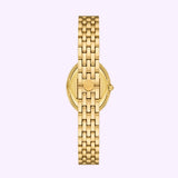 A gold-tone stainless steel wristwatch, the Tory Burch Watches THE OVAL Women TBW6038, is displayed from the back to showcase its linked metal bracelet and clasp engraved with the brand’s logo, set against a plain light background. This elegant piece by Tory Burch Watches effortlessly blends timeless design with modern sophistication.