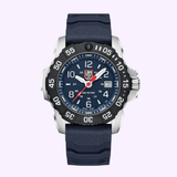 A rugged Luminox Watches Navy SEAL Rubber, Steel, CARBONOX™ (RSC) 45 mm (SKU: XS.3253.CB) with a blue face, CARBONOX™ bezel, silver casing, and blue strap, displaying the time as 10:08:37 and the date as the 26th.