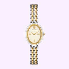 A Tory Burch Watches THE OVAL TBW6033 women’s watch, featuring a gold and silver two-tone link bracelet, an oval face with a minimal design and gold hour markers, is displayed against a light lavender background.