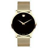 The Movado 0607396 Museum Classic features a gold stainless steel mesh strap, a black minimalist face with a single gold dot at 12 o’clock, and the Movado Watches brand name near 6 o’clock—an elegant men's Swiss quartz watch.