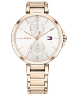 The Tommy Hilfiger 1782124 men’s watch features a gold-tone case, white dial with subdials for day and date, rose gold hour markers, the logo at 3 o’clock, and a matching metal link bracelet.