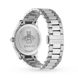 The image shows the back of a Gucci Watches YA1264136 G-Timeless Unisex Watch with a metal link band, featuring an engraved bee, Gucci logo, and markings for Swiss Made and water resistance.