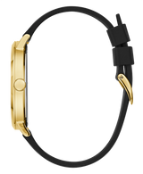 Side view of the Guess Watches U1161G1 IMPRINT men’s watch with a gold case, gold bezel, black round crown, and black silicone strap featuring a gold buckle and two black loops. Watch face is not visible.