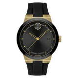 The Movado 3600623 Bold Fusion by Movado Watches features a black face, gold hands and markers, date window at 3 o’clock, signature dot at 12, and a sleek black silicone strap.