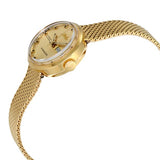The Mido M716937213 Commander Mesh Strap Women’s Watch by Mido Watches is shown on a white background, featuring a gold mesh strap, round face, date display, Swiss automatic movement, black hour markers, and gold hands.