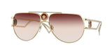The Versace VE2225 10020P 60 Unisex Sunglasses feature a gold frame, brown gradient lenses, and face logo medallions on the bridge and temples, blending iconic Versace style with luxury appeal.