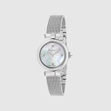 The Gucci Watches YA141504 for women features a stainless steel mesh strap, a round mother-of-pearl dial with minimalist hour markers at 12, 3, 6, and 9 o’clock, and a light gray background from the Diamantissima collection.