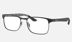 The Ray-Ban RX8416 2503 53 Unisex Optical Frame features a black rectangular thin metal design with clear lenses, patterned inner arms, and a small white logo on the outer arms, by Ray-Ban Optical.