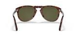 A pair of Persol PO0714SM 24/P1 54 unisex sunglasses by Persol Sunglasses, featuring a classic tortoiseshell folding frame and green lenses, shown front-facing with open arms—a Steve McQueen-inspired accessory.