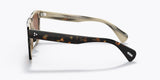 Side view of Oliver People OV5444SU 166673 54 Casian Unisex Sunglasses featuring one light beige translucent arm and one dark tortoiseshell-patterned arm, both with silver hinge details. A stylish unisex option from Oliver People Sunglasses.