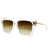 Balmain BPS-100D-56 B-I Unisex Sunglasses by Balmain Sunglasses feature clear square frames, gradient brown lenses, and gold hinges. Displayed on a white background, they offer modern style with timeless elegance.