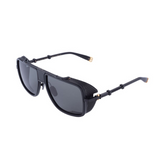 The Balmain O.R. BPS-104C-59 Unisex Sunglasses from Balmain Sunglasses feature a black titanium frame, dark lenses, side shields, gold hinge and temple tip accents, and a bold modern design inspired by retro rectangular shapes.